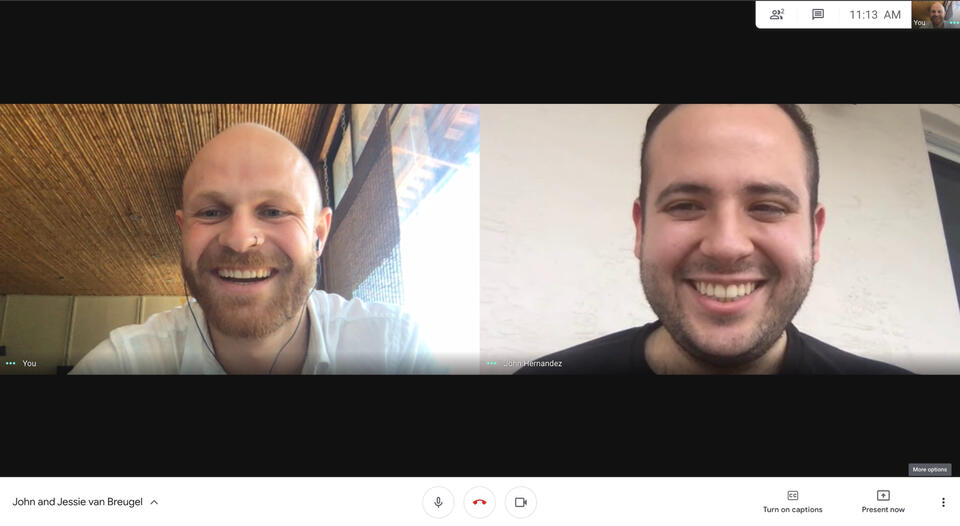 man writing on post-it notes before whiteboard